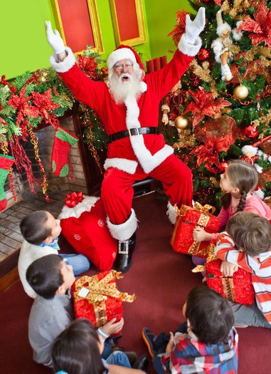 Group of kids with Santa Claus at Christmas time