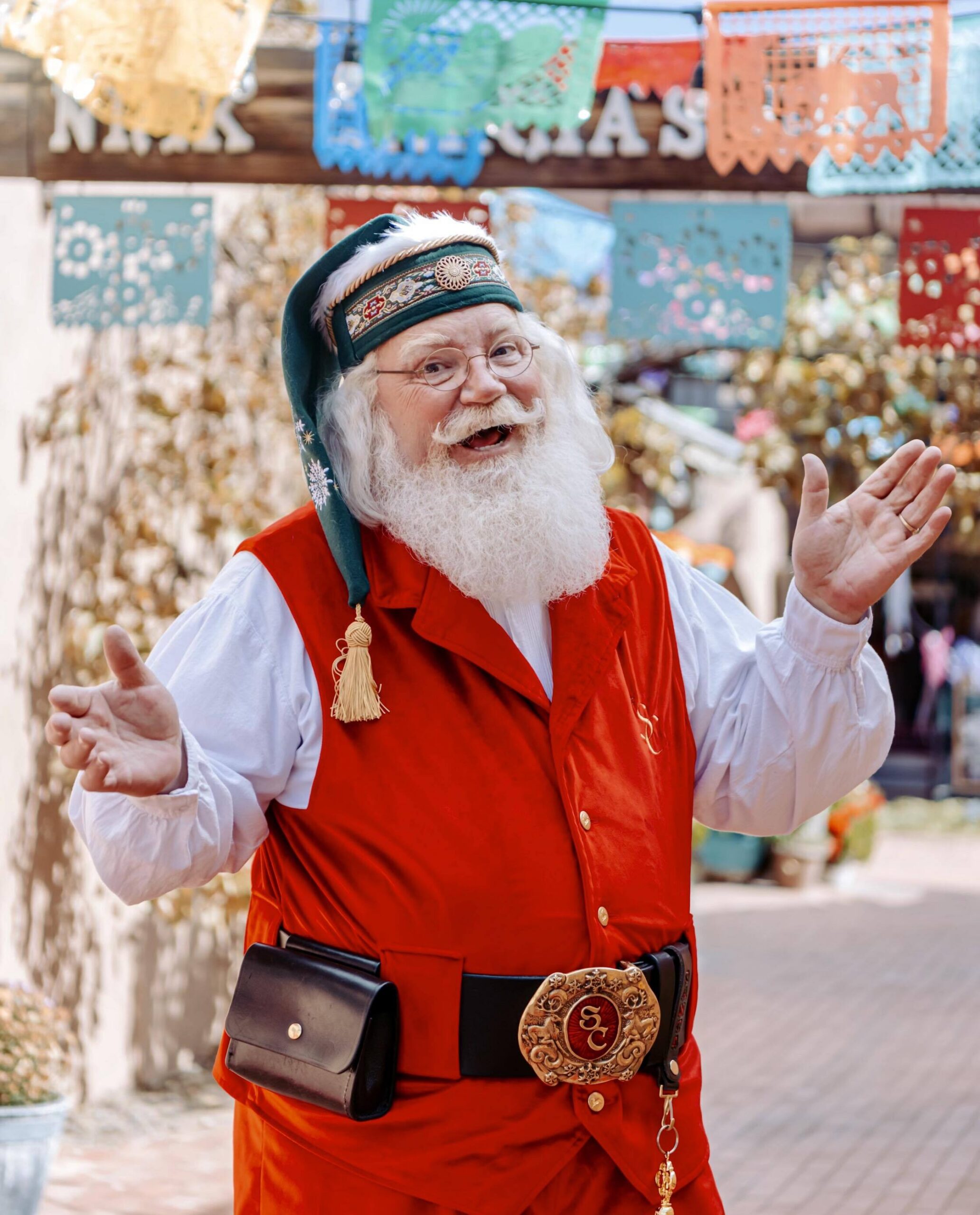 Professional Santa Claus in Raleigh North Carolina greeting guests at a holiday market